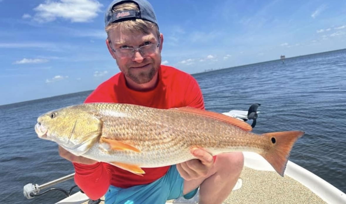 A catch held up on the boat on Tampa Bay
