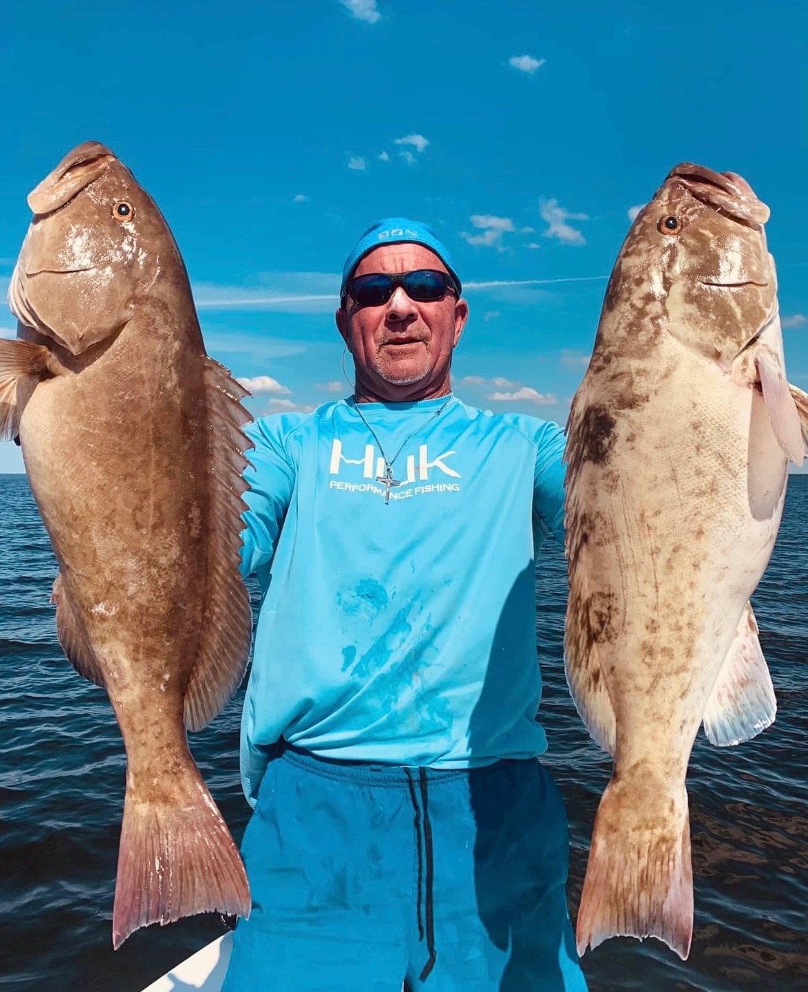 Guests with their catch aboard an Apollo Beach charter